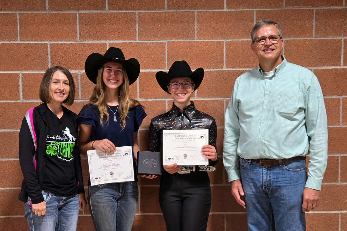 Killian Baker and Jenna Stutzman receive the 2025 Karen Richardson Memorial 4-H Horseman of the Year Scholarship from Kris Hiney and Steve Beck.